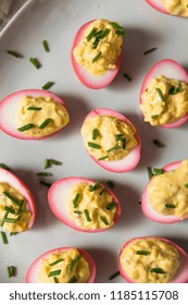 Homemade Pink Pickled Deviled Eggs With Chives