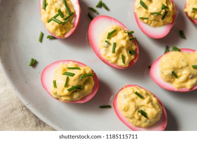 Homemade Pink Pickled Deviled Eggs With Chives