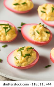 Homemade Pink Pickled Deviled Eggs With Chives