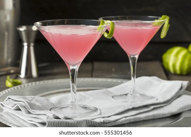 Homemade Pink Vodka Cosmopolitan Drink With A Lime Garnish