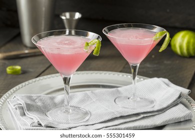 Homemade Pink Vodka Cosmopolitan Drink With A Lime Garnish