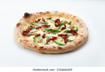 Homemade pizza with avocado and sun-dried tomatoes. On a light background. Selective focus. - Powered by Shutterstock