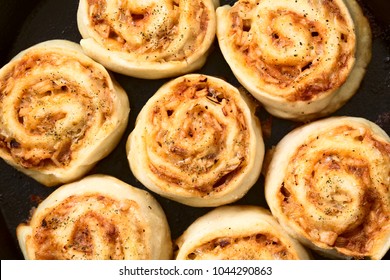 Homemade Pizza Rolls Or Pinwheels Filled With Ham, Onion, Tomato Sauce And Cheese, Photographed Overhead With Natural Light (Selective Focus, Focus On The Top Of The Rolls)