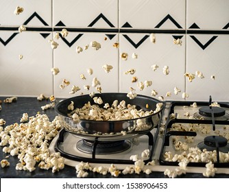 Homemade Popcorn Popping Wildly From A Frypan On A Gas Stovetop.