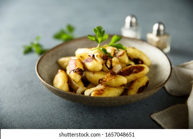 Homemade potato dumplings with fried onion