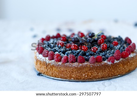 Homemade pound cake garnished with fresh berries.