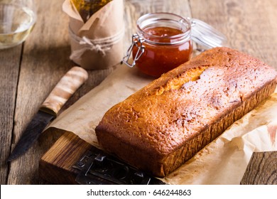 Homemade Pound Cake On Baking Paper Served With Fruit Jam Ready To Eat On Rustic Wooden Background, Delicious Brunch Or Tea Time Table