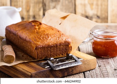 Homemade Pound Cake On Baking Paper Served With Fruit Jam Ready To Eat On Rustic Wooden Background, Delicious Brunch Or Tea Time Table