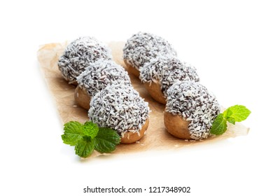 Homemade  Profiteroles Covered With Desiccated Coconut Isolated On White 