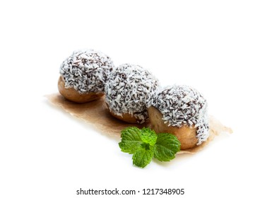 Homemade  Profiteroles Covered With Desiccated Coconut Isolated On White 