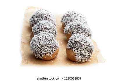 Homemade  Profiteroles Covered With Desiccated Coconut Isolated On White 