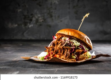 homemade pulled pork burger with bbq sauce - Shutterstock ID 1169918173