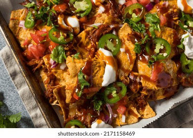 Homemade Pulled Porrk Nachos With BBQ Sauce And Cheese