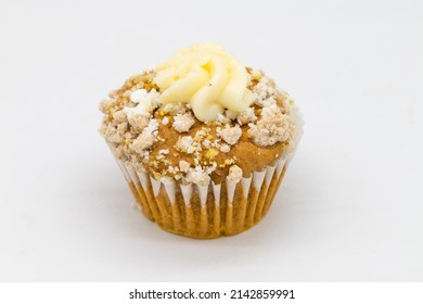 Homemade Pumpkin Muffin With Frosting On A White Background