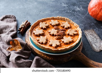 Homemade Pumpkin Pie For Thanksgiving Table Dinner Menu On A Wooden Cutting Board. Side View, Selective Focus