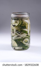 Homemade Quick Pickles Cucumbers And Onions Stored In Mason Jar. Delicious Vegetarian Appetizer. White Isolated.