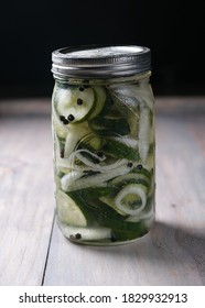 Homemade Quick Pickles Cucumbers And Onions Stored In Mason Jar On A Wooden Table. Delicious Vegetarian Appetizer.