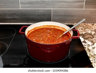 Homemade Red Pasta Sauce Simmering On Stove For Family Dinner