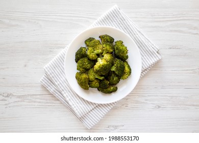 Homemade Roasted Broccoli With Salt And Pepper On A Plate On A White Wooden Table, Top View. Flat Lay, Overhead, From Above. 