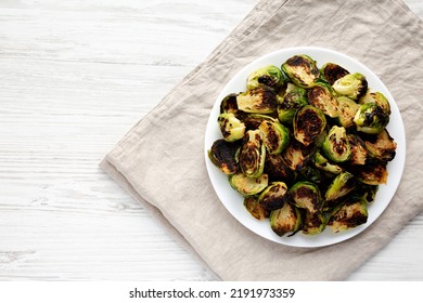 Homemade Roasted Brussel Sprouts On A Plate, Top View. Flat Lay, Overhead, From Above. Copy Space.