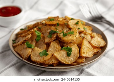 Homemade Roasted Garlic Parmesan Potatoes on a Plate, side view. Close-up. - Powered by Shutterstock