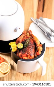 Homemade Roasted Whole Chicken With Lemon, Rosemary, Vegetable On Air Fryer. Copy Space For Text 