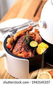 Homemade Roasted Whole Chicken With Lemon, Rosemary, Vegetable On Air Fryer. Copy Space For Text 