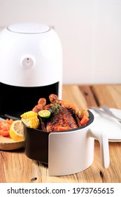 Homemade Roasted Whole Chicken With Lemon, Rosemary, Vegetable On White Mini Air Fryer. Copy Space For Text 