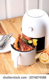 Homemade Roasted Whole Chicken With Lemon, Rosemary, Vegetable On Air Fryer. Copy Space For Text 