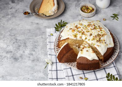 Homemade Round Sponge Hot Milk Cake With Buttercream And Pistachios