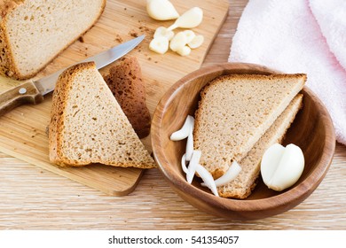 Homemade rye bread sliced, onions and garlic