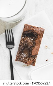 Homemade Salted Caramel Brownie With Glass Of Milk And Fork