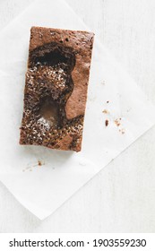 Homemade Salted Caramel Brownie On White Wooden Board