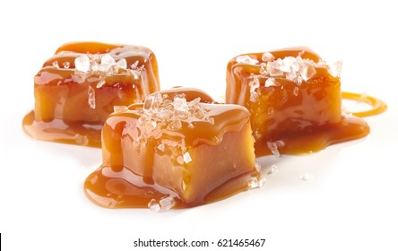 homemade salted caramel pieces isolated on white background - Shutterstock ID 621465467