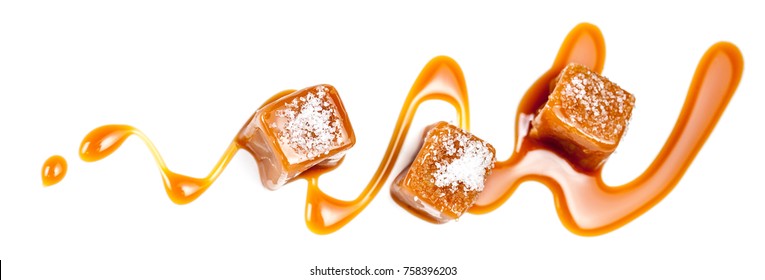 Homemade Salted Caramel Pieces Isolated On White Background. Golden Butterscotch Toffee Candy Caramels Macro.
