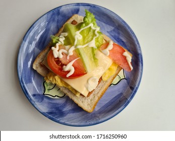 Homemade Sandwhich Blue Plate In A White Background