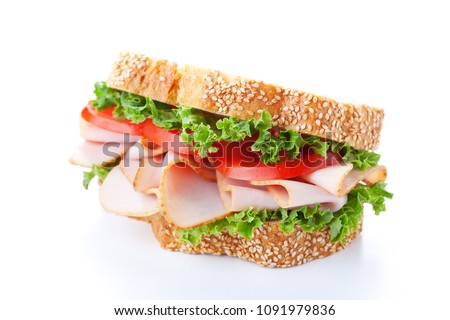 Homemade sandwich with smoked turkey and lettuce