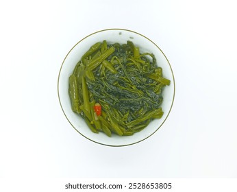 Homemade sauteed kale and a small white bowl - Powered by Shutterstock