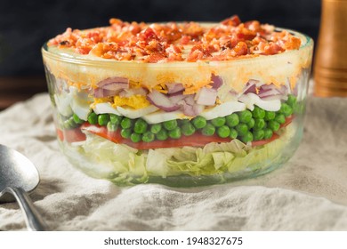 Homemade Seven Layer Salad with Eggs Bacon Peas and Lettuce - Shutterstock ID 1948327675