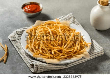 Homemade Shoesttring French Fries with Salt and Ketchup