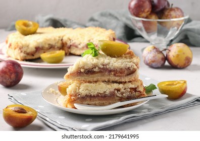 Homemade Shortbread Plum Pie With Cut Pieces On Plate On Light Gray Background