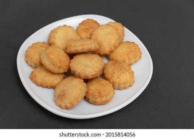 Homemade shortcrust pastry cookies on white plate. Baking for tea. Appetizing cookies. Gray background - Shutterstock ID 2015814056