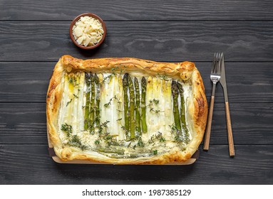 Homemade shortcrust quiche made with green and white asparagus, cream, and parmesan cheese. Healthy, vegetarian recipe. puff pastry tart. - Shutterstock ID 1987385129
