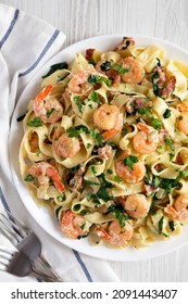 Homemade Shrimp Spinach Bacon Alfredo On A Plate, Top View. Flat Lay, Overhead, From Above. 