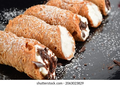 Homemade sicilian cannoli with ricotta and chocolate chips. Shallow DOF.