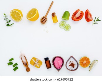 Homemade skin care and body scrubs with natural ingredients aloe vera ,lemon,cucumber ,himalayan salt ,tomato,mint and honey set up on white wooden background with flat lay.