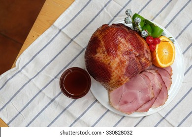 Homemade of Sliced Honey Gammon Ham with Orange, Cherry, Sweet Pepper and Honey Sauce for Festive dinner, Christmas dinner, Holiday table, Thanksgiving day celebration - Copy Space, From Above - Powered by Shutterstock