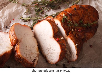 Homemade Sliced Roasted Turkey Fillet Close Up On Paper. Horizontal
