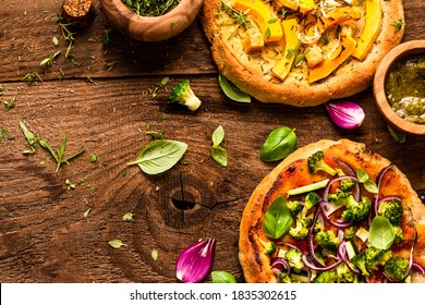 Homemade Small Vegetarian Pizza On Wooden Rustic Table. Top Down View.