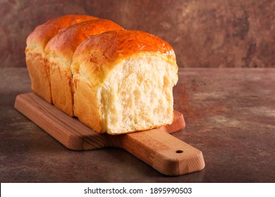 Homemade soft, fluffy white bread loaf, Japanese milk bread - Shutterstock ID 1895990503